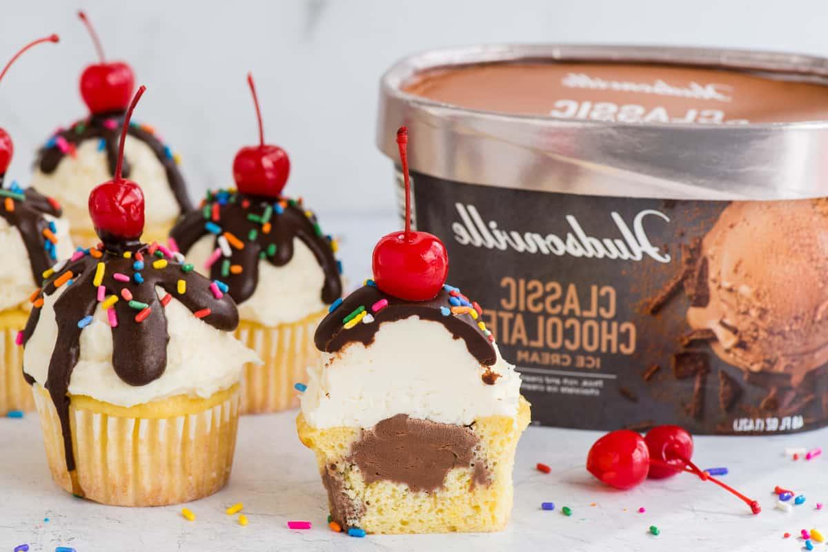 ice cream cupcakes arranged on white surface with Hudsonville ice cream container in the background