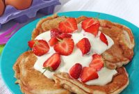 Fluffy Strawberry Yogurt Pancakes with Fresh Berry Sauce