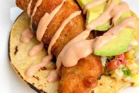 Halibut Tacos with Old Bay Crema and Citrus Slaw