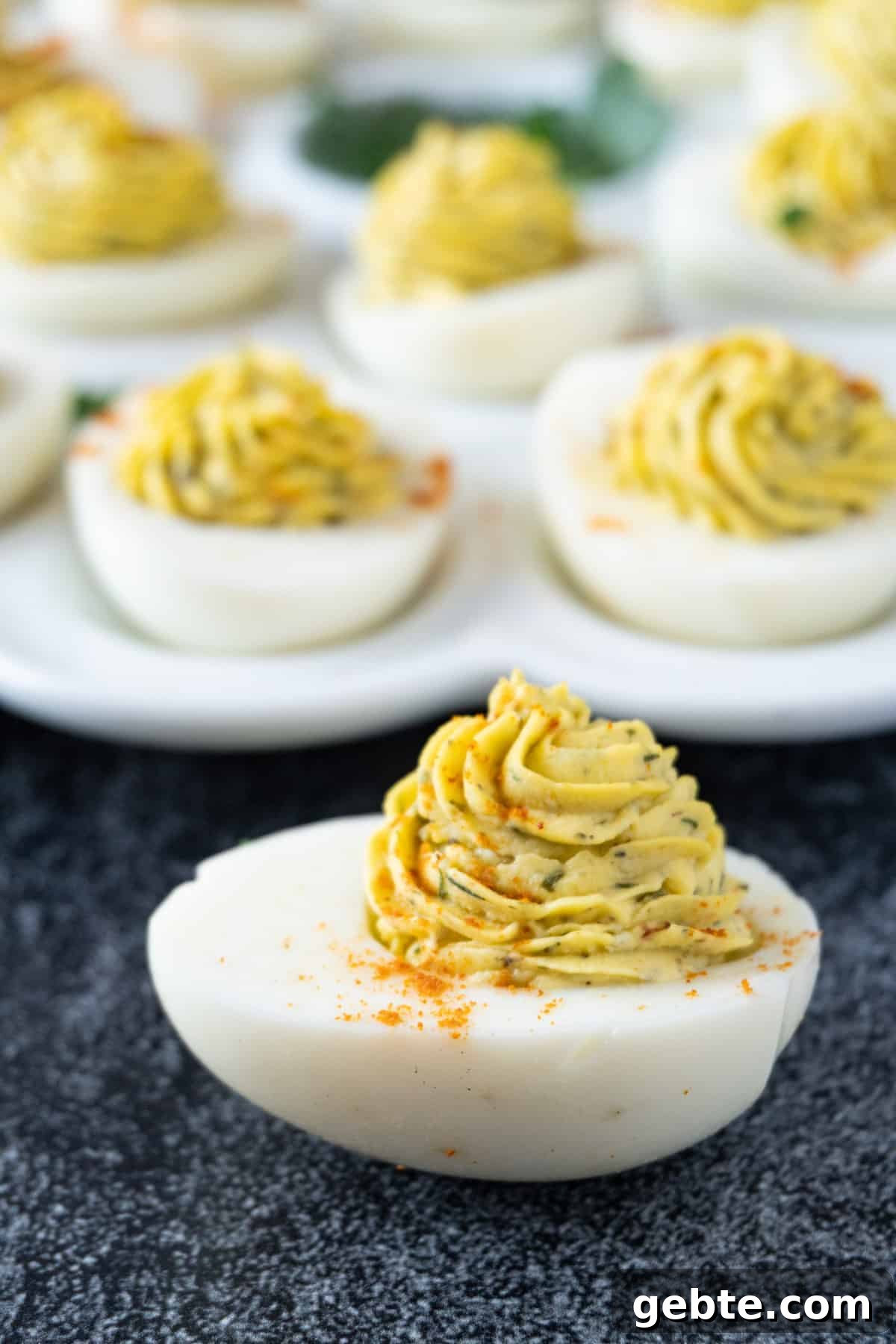 Deviled egg with platter in background