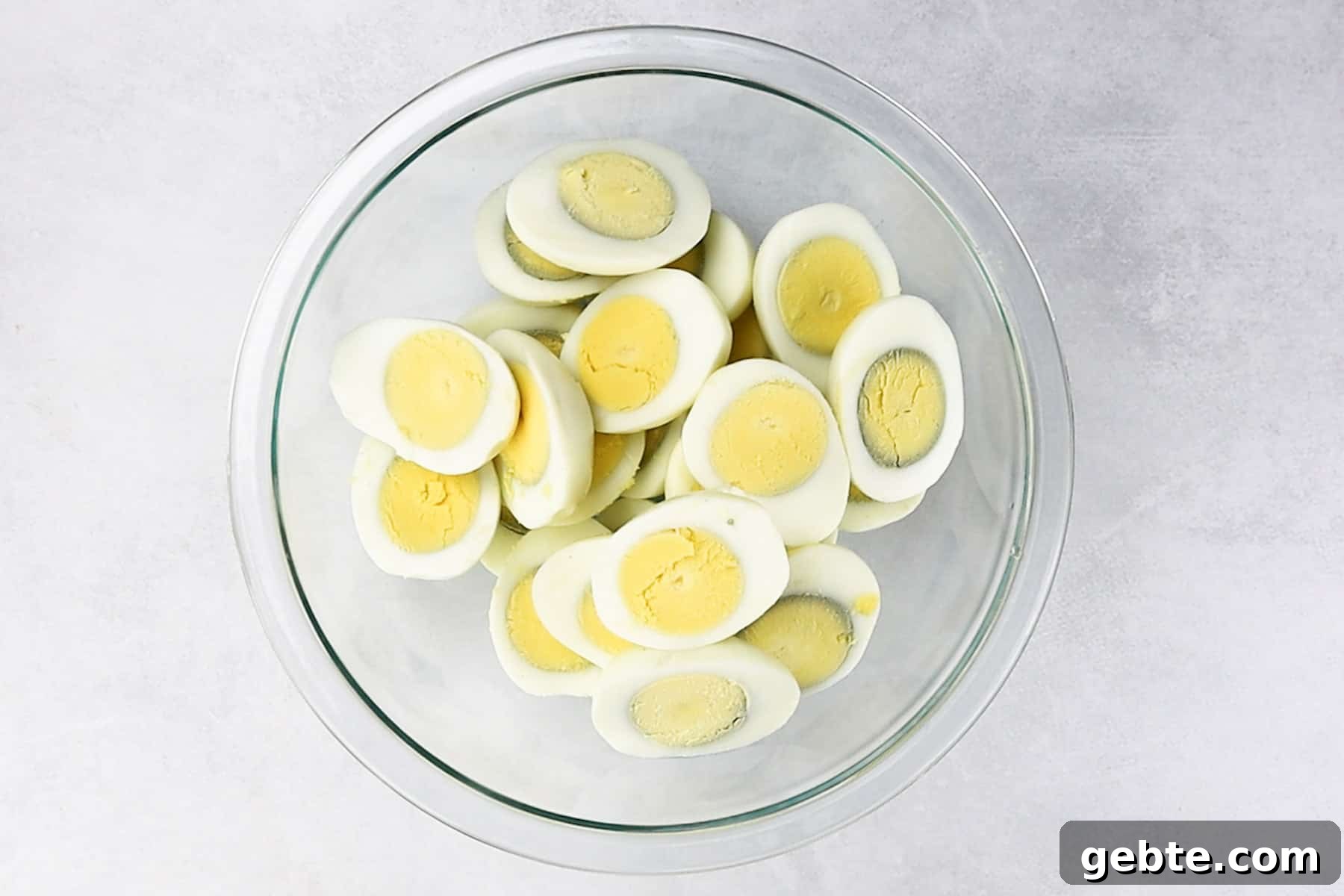 hardboiled eggs cut in half in bowl