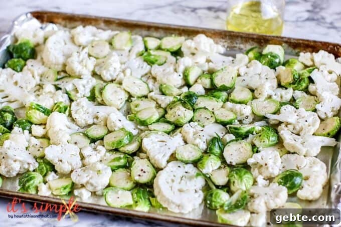 brussels sprouts and cauliflower on a sheet pan.
