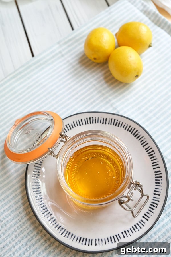 top view of golden syrup in a jar with open lid