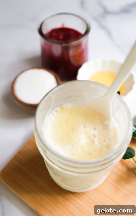 golden syrup ice cream in a glass with spoon