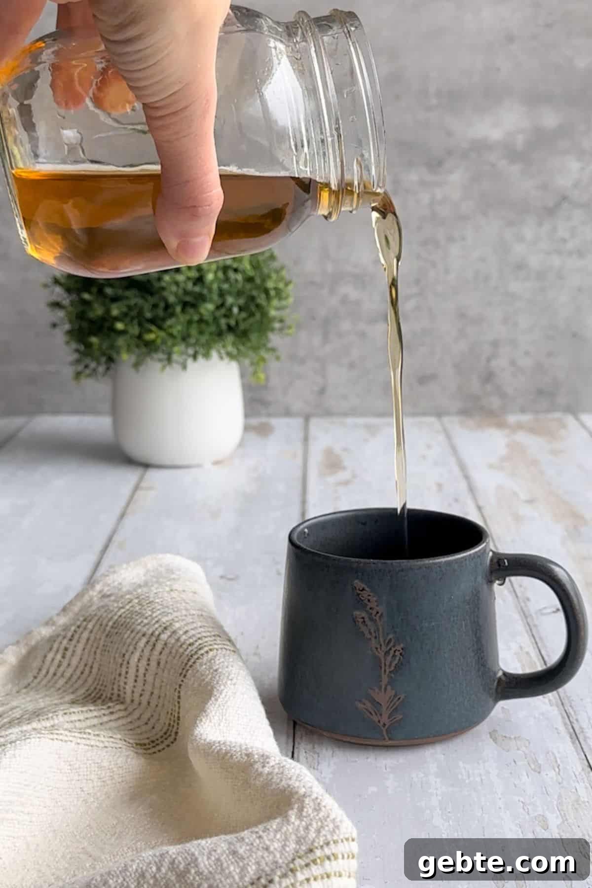 Vanilla syrup poured into coffee.