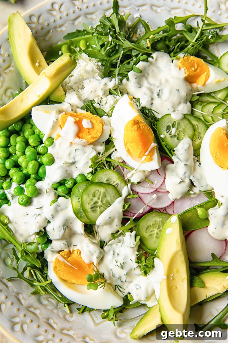 Spring Pea & Arugula Salad with Creamy Dill Dressing 3 close up of the pea salad with boiled eggs, avocados and arugula