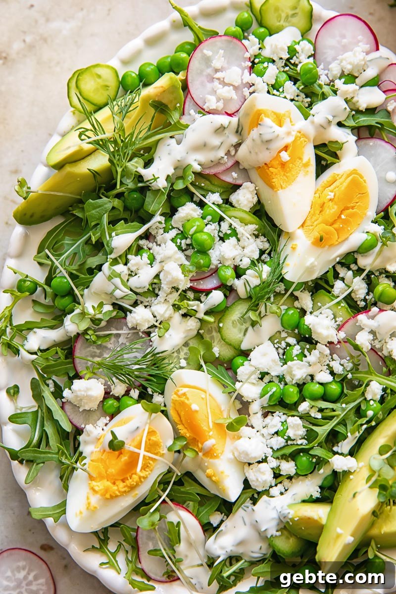 Spring Pea & Arugula Salad with Creamy Dill Dressing 5 close up of the green pea salad with eggs, rocket and feta