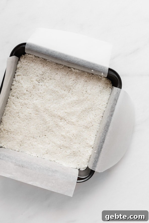 an 8x8 inch pan with coconut in it