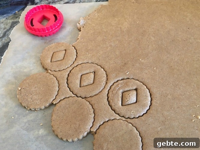 Linzer cookie cutters and cookie dough.