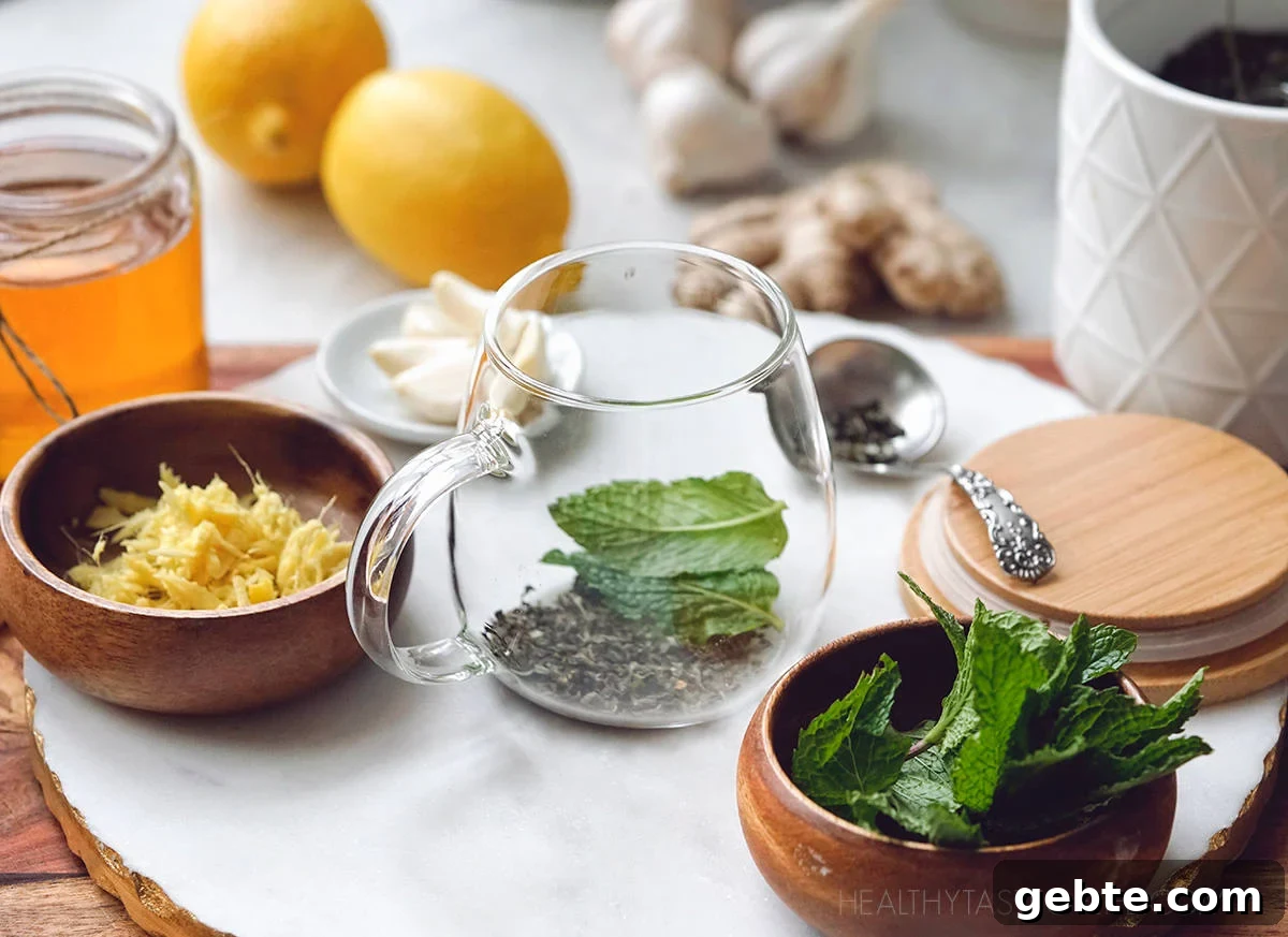 Cold & Flu Relief Drink Recipe — Soothing Winter Immune Boost 4 Ingredients prepared for making the flu bomb tea - lemon ginger garlic honey drink.