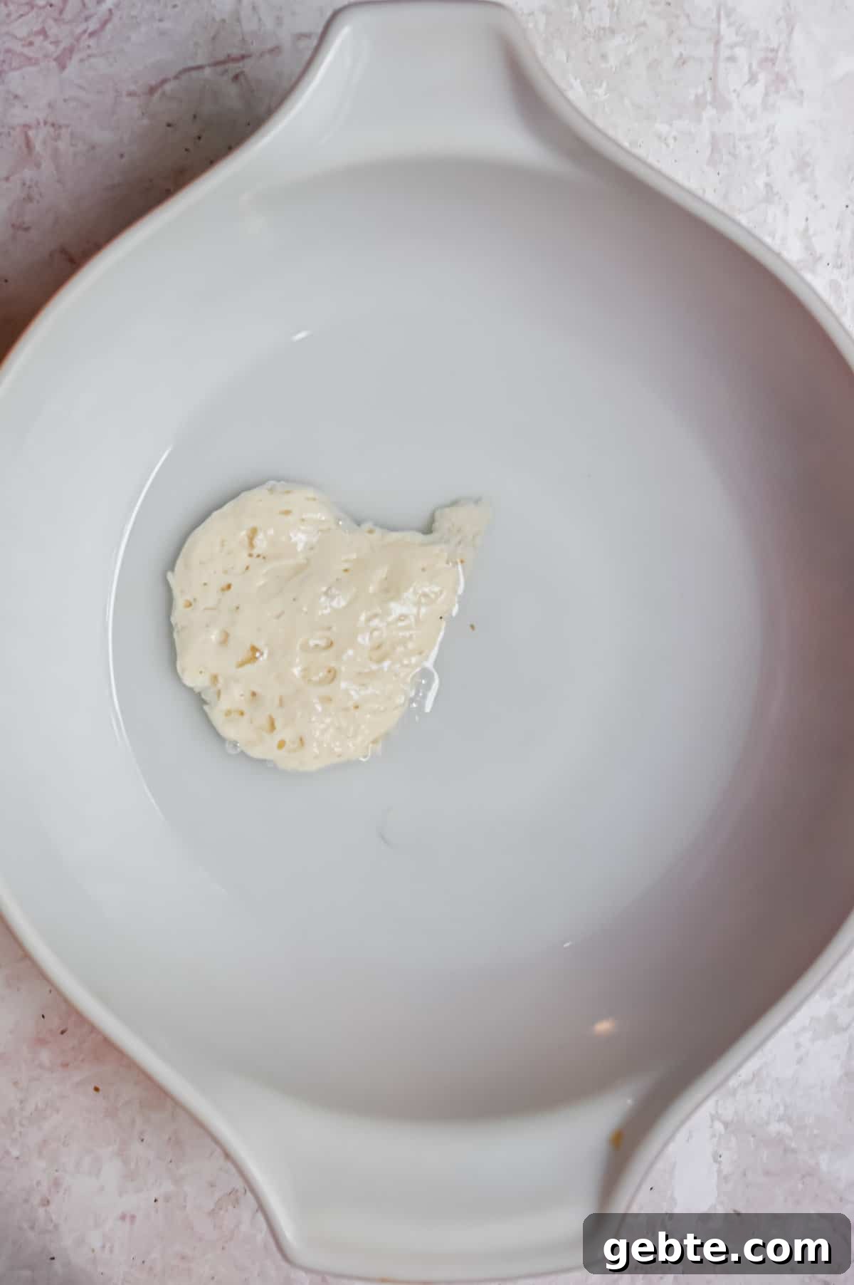 The starter and water are in a large bowl.