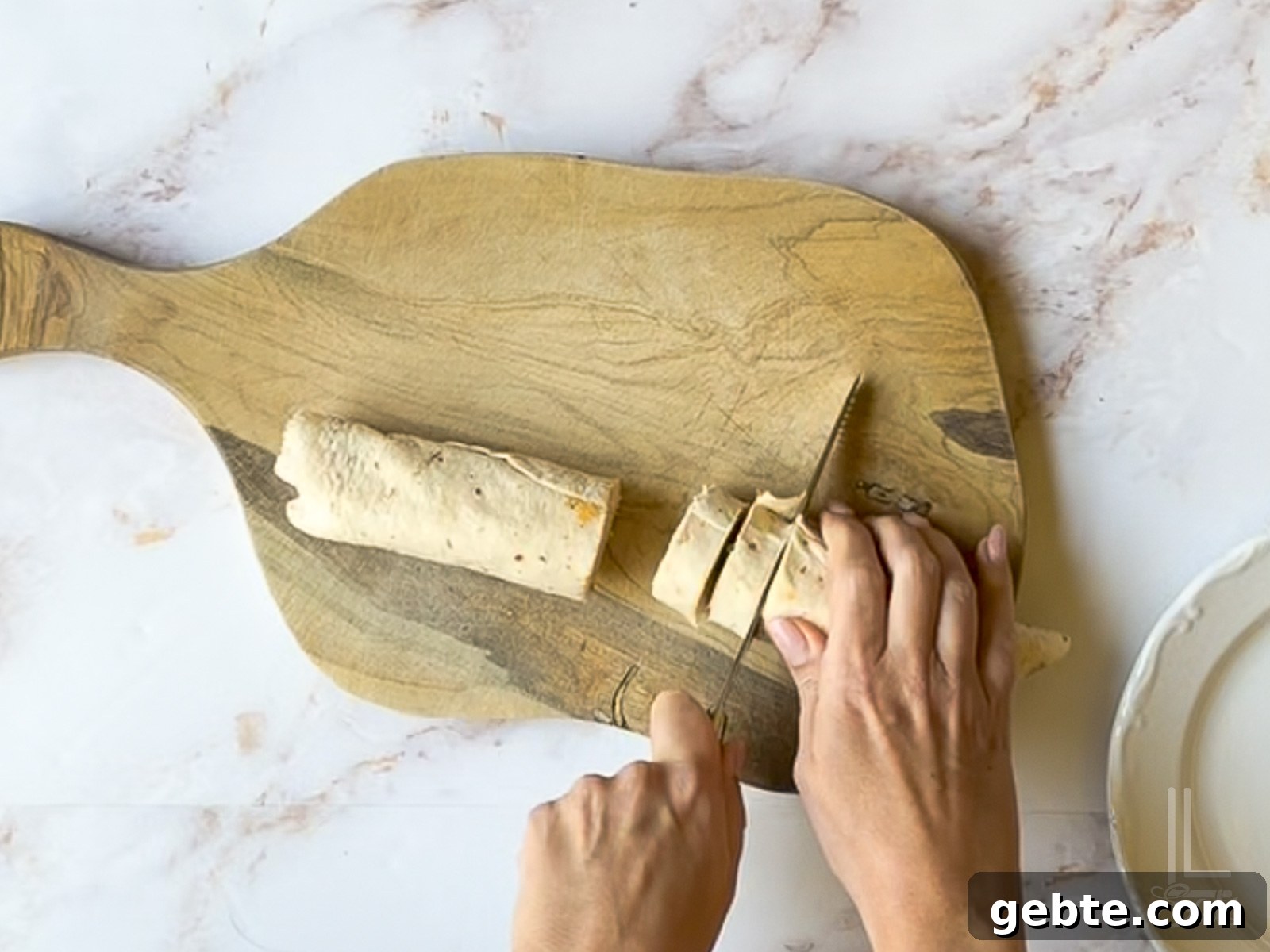 cutting unwrapped tortilla with a knife.