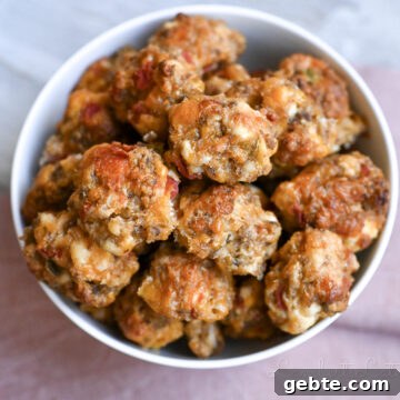 rotel cream cheese sausage balls in a bowl, next to a napkin.
