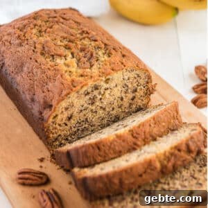Sliced banana bread on a cutting board.
