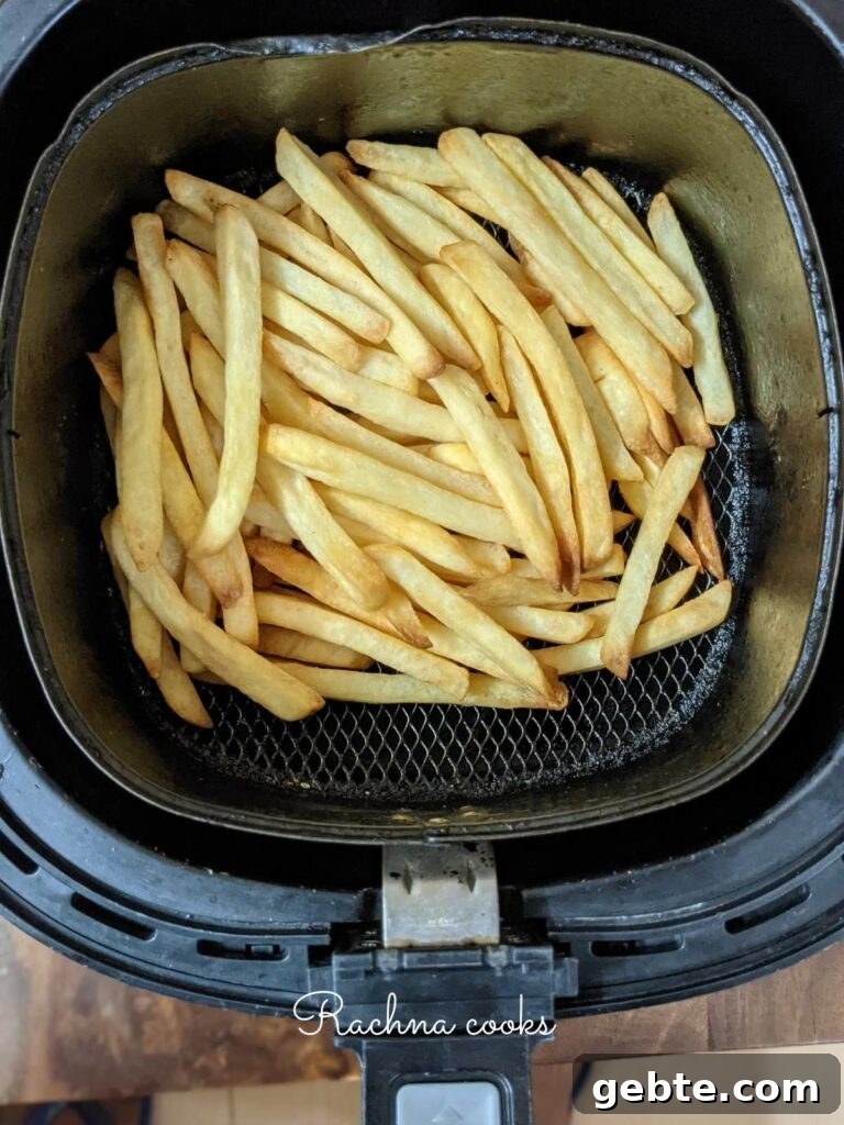 Crispy french fries done in air fryer from frozen in the air fryer basket.