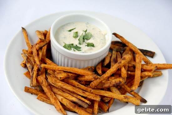 SWEET POTATO FRIES & TANGY APRICOT DIP Caribbean Sweet Potato fries on plate and Tangy Apricot Dip in ramekin