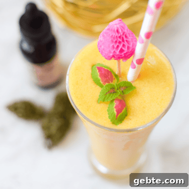 Mango Cannabis Smoothie Bowl Recipe for Relaxing Mornings 10 Tropical fruit and veggie cannabis smoothie in a glass.