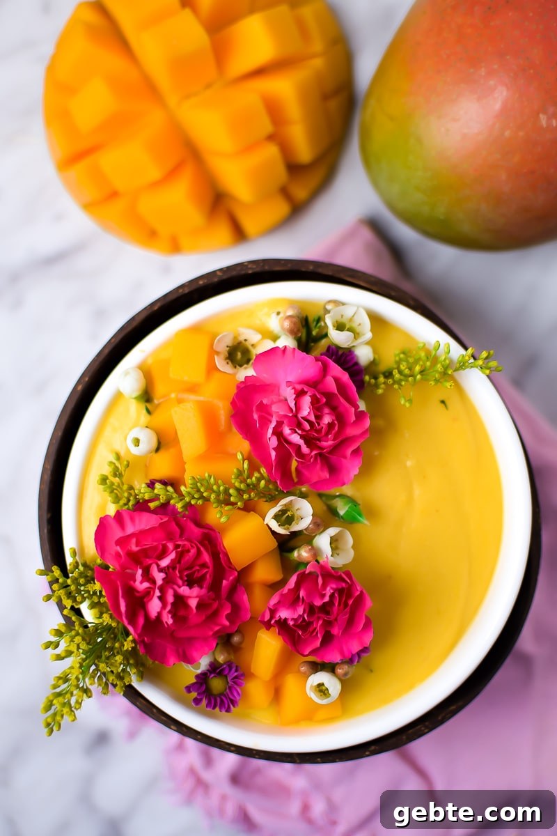 Mango Cannabis Smoothie Bowl Recipe for Relaxing Mornings 6 Springtime Mango Smoothie Bowl with Edible Flowers by Emily Kyle Nutrition