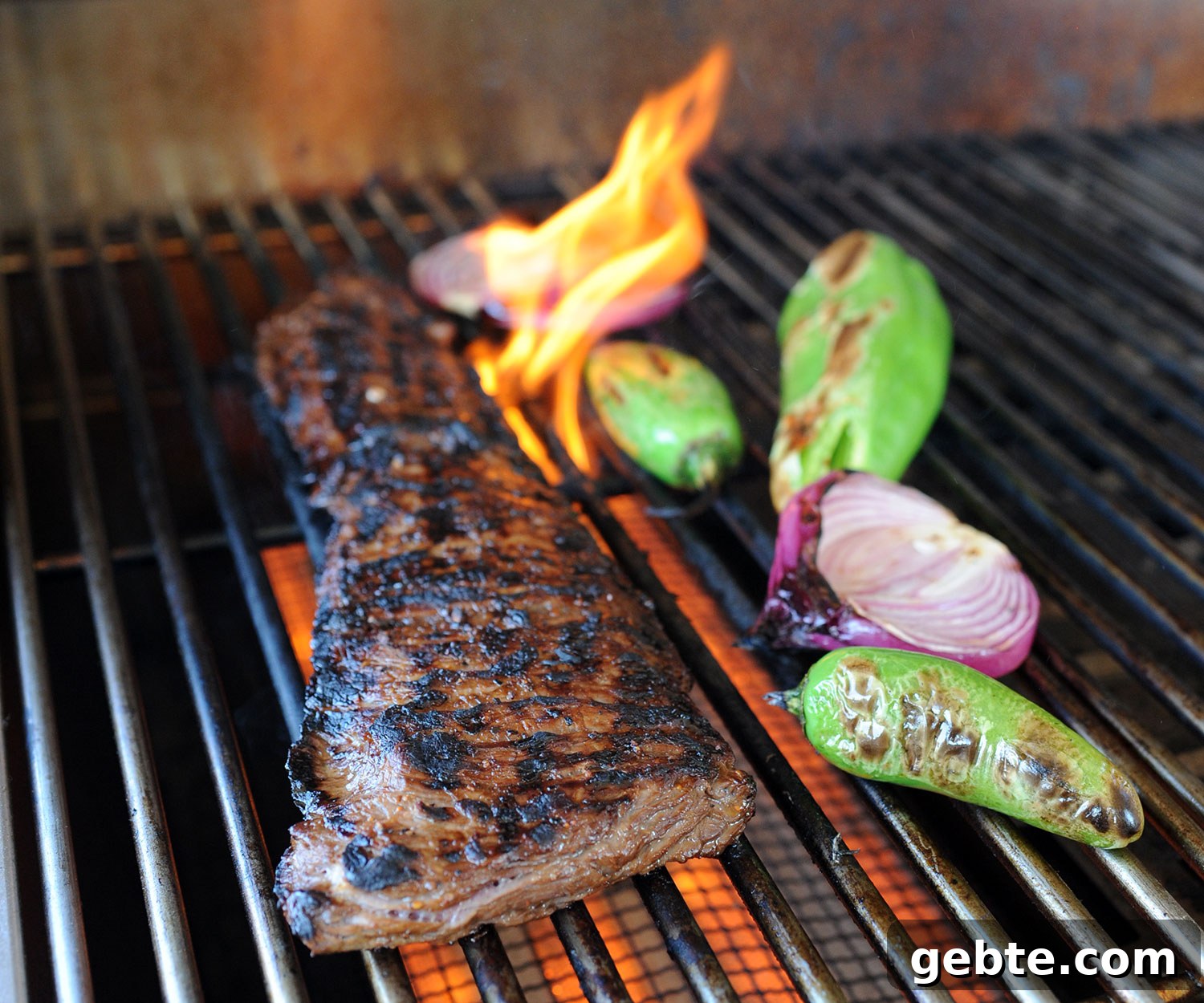 Grilled Skirt Steak Tacos with Charred Lime and Cilantro 6 flame kissing a skirt steak on the grill
