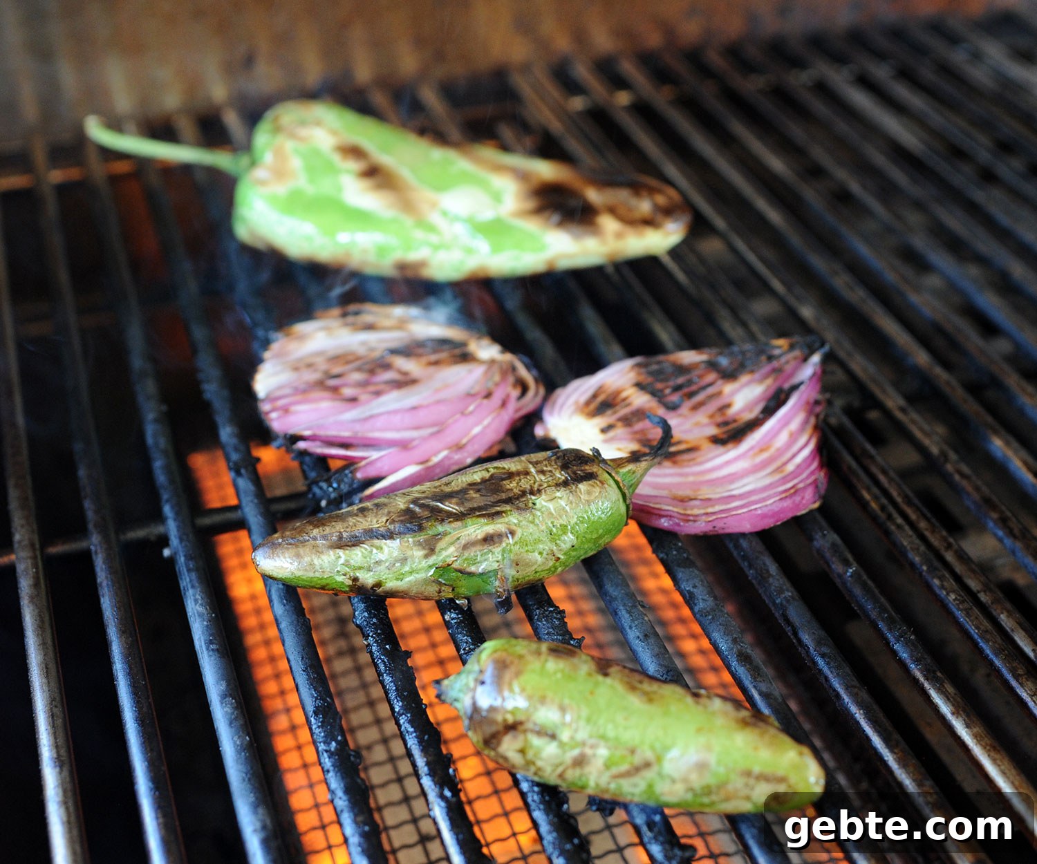 Grilled Skirt Steak Tacos with Charred Lime and Cilantro 9 peppers and onions grilling.