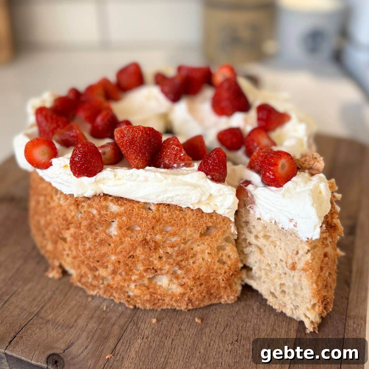 angel food cake with whipped cream and strawberries