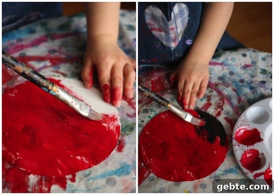 painting paper plates with red paint