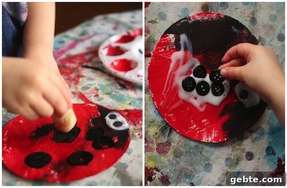stamping black spots with a cork on red paper plate