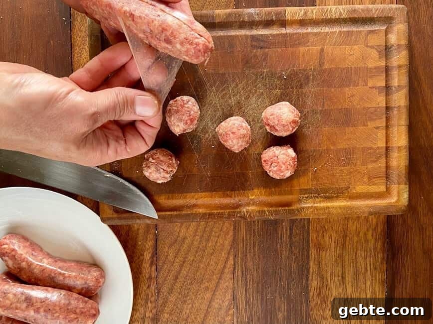 One-Pot Sausage and Meatball Pasta Skillet 5 Uncasing sausage meat.