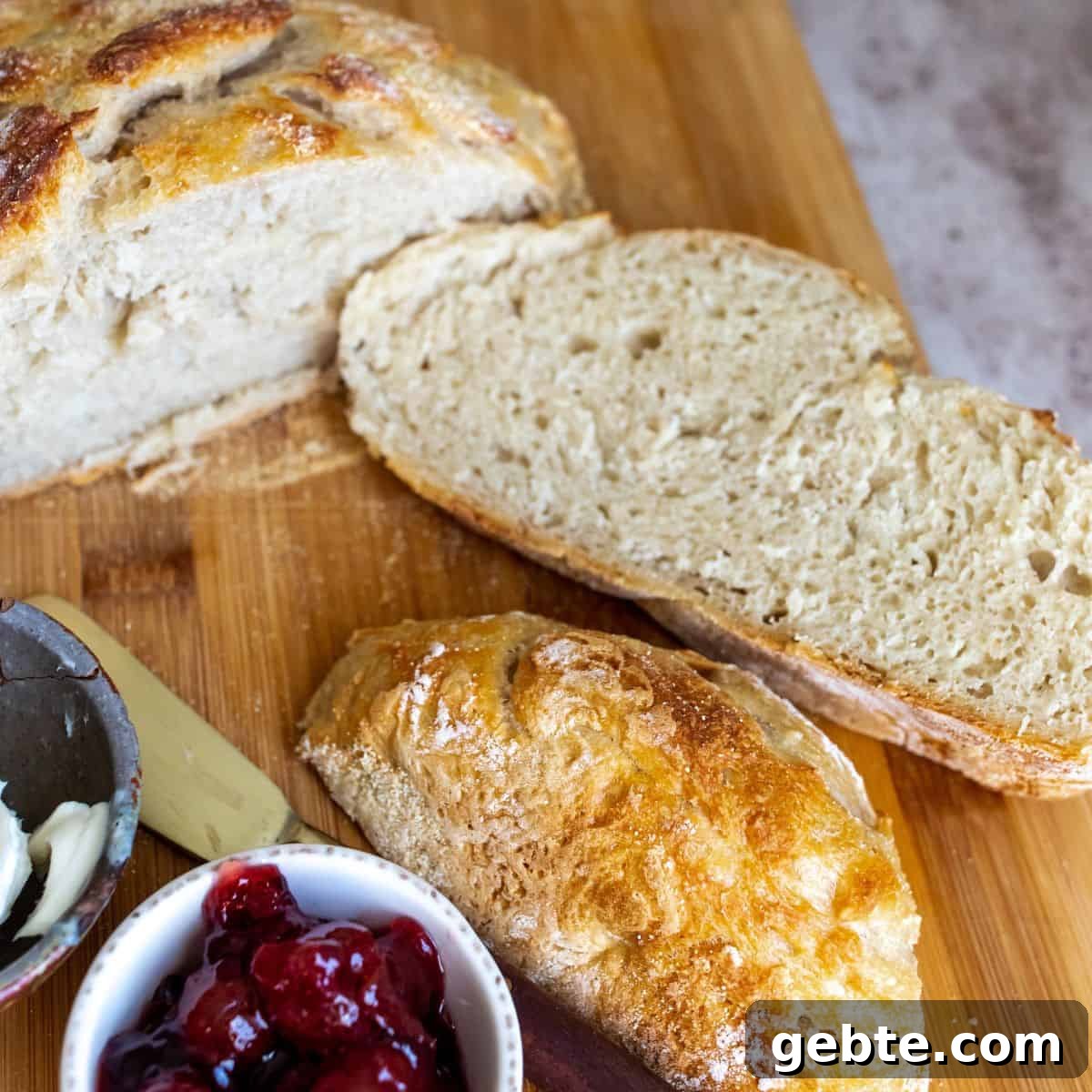 Up close photo of bread with jelly next to it. 