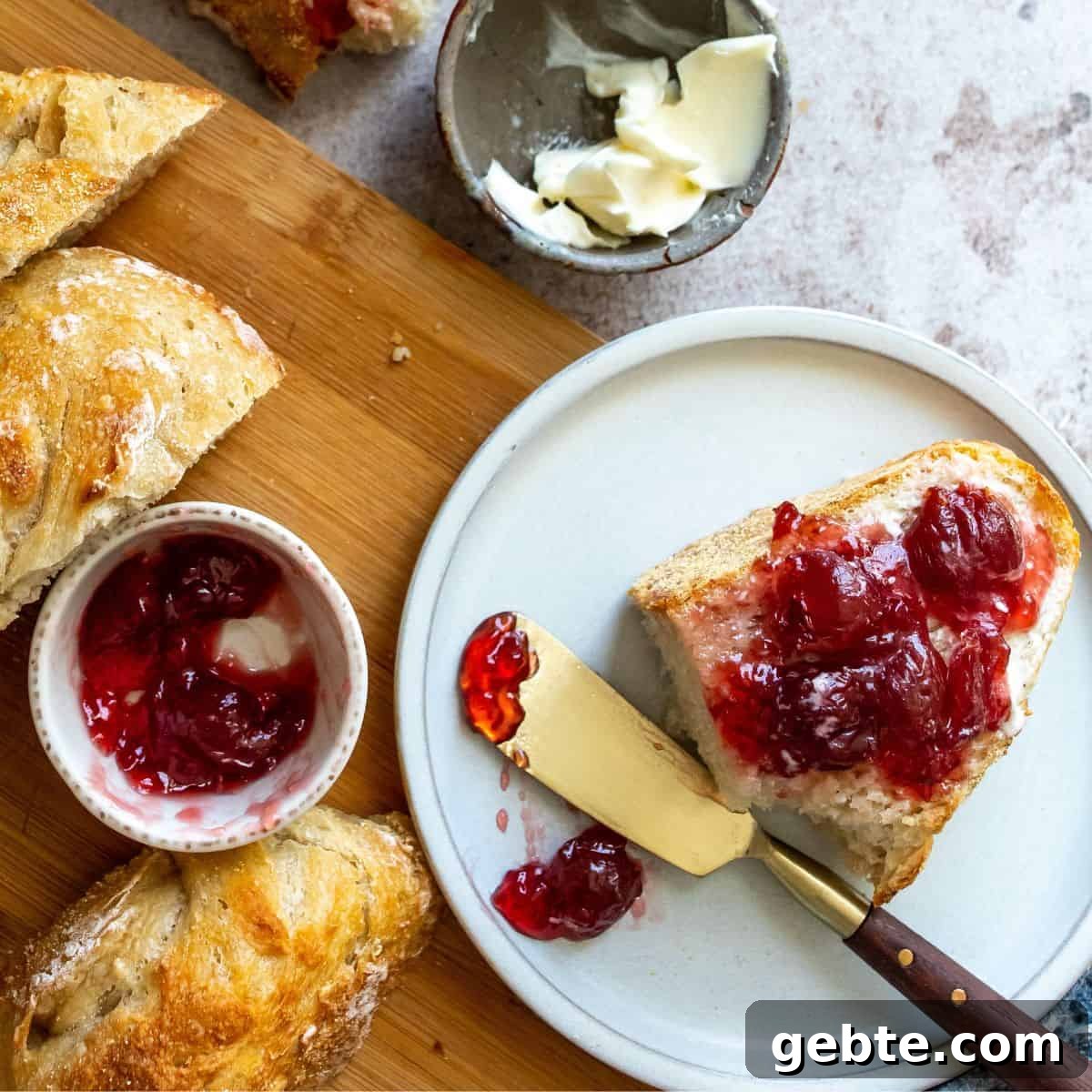 Bread on a white plate with jam on it. 