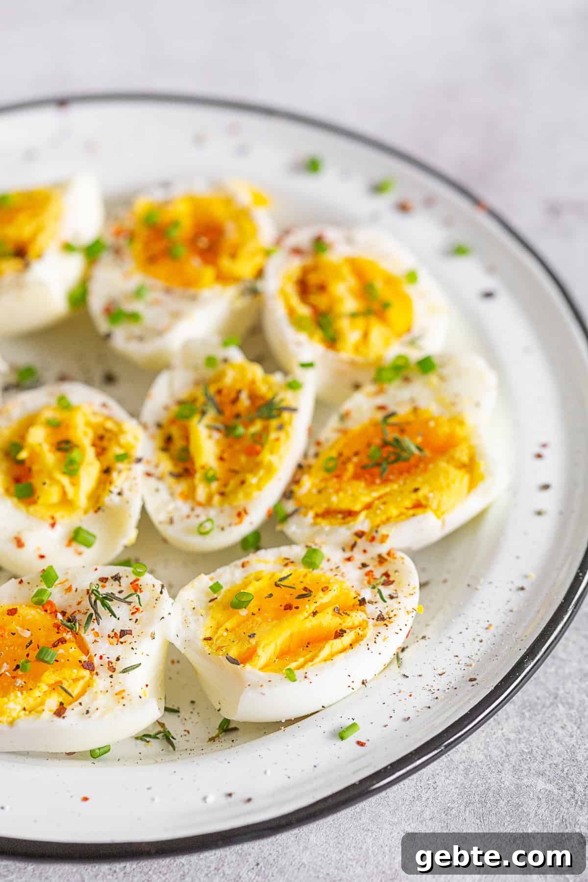 Instant Pot Hard Boiled Eggs topped with fresh herbs and spices.