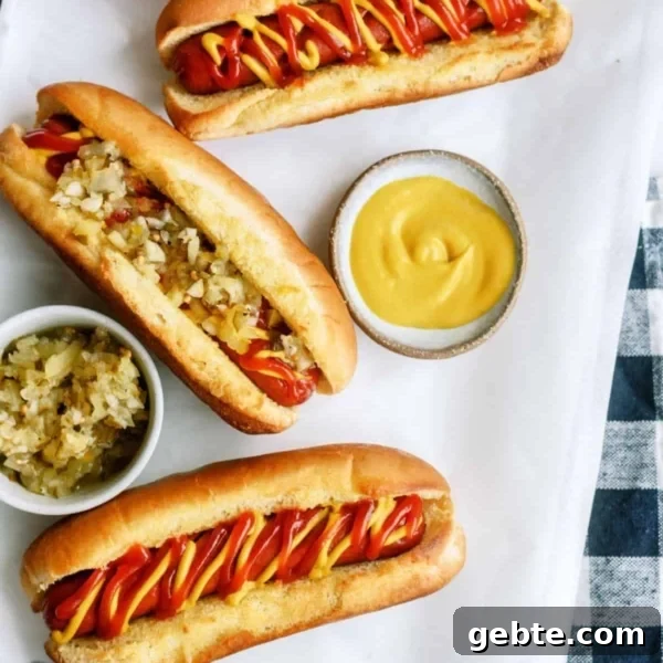Air Fryer Hot Dogs on a table with toppings