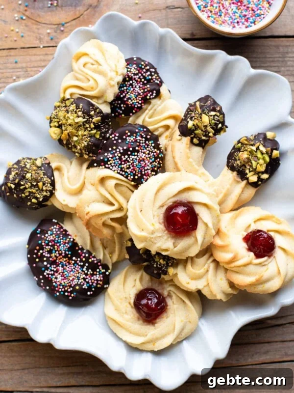 An overhead shot of Italian butter cookies on a star shaped plate covered with chopped nuts and sprinkles. The background is wooden.