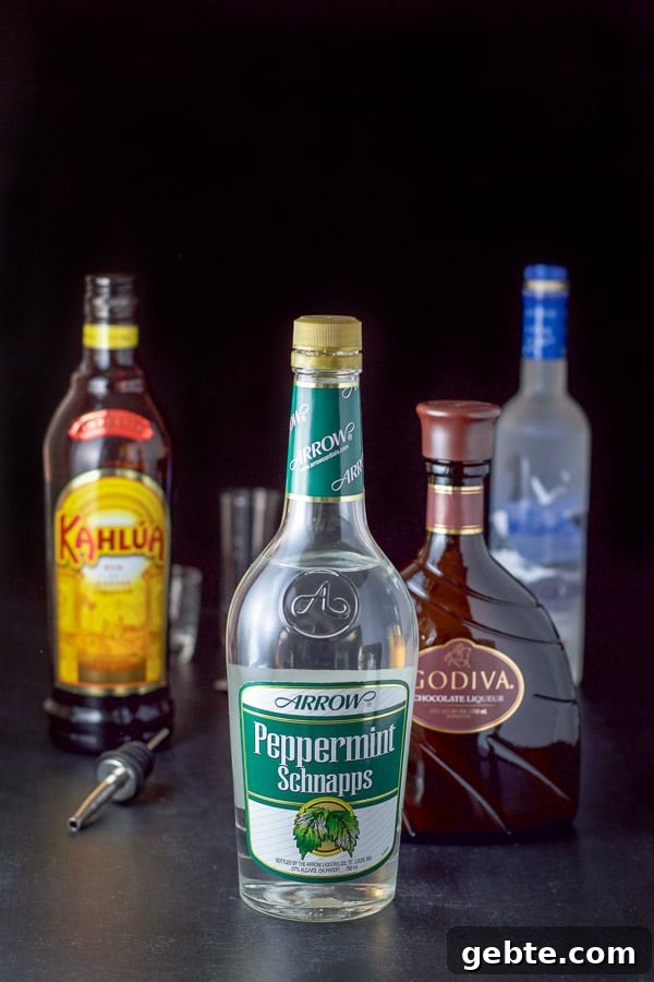 Peppermint schnapps, kahlua, chocolate liqueur and vodka on the table