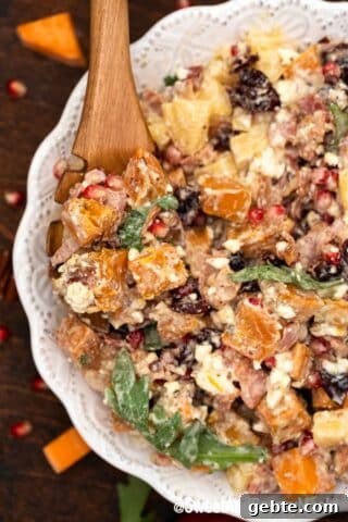 mixed sweet potato salad in a white bowl