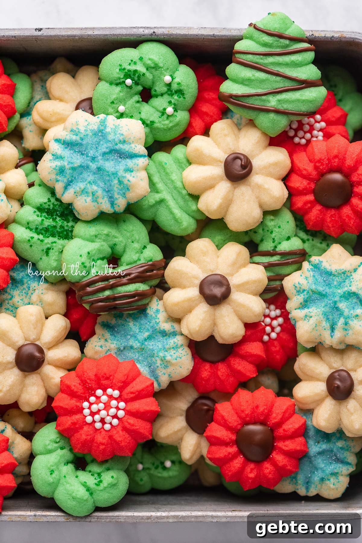 Pile of classic spritz cookies | © Beyond the Butter®