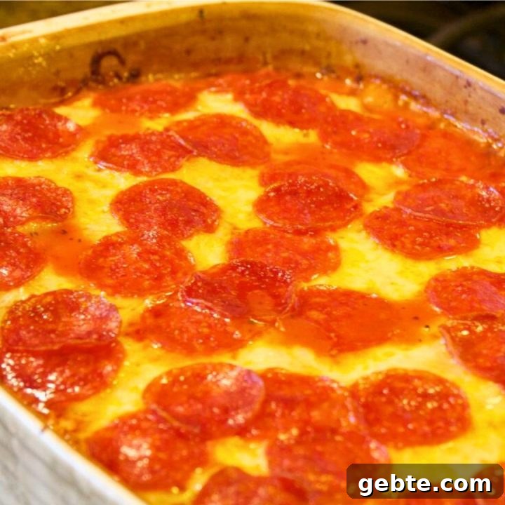 Meat lovers pizza casserole is a simple pizza pasta casserole recipe loaded with pepperoni and sausage, spaghetti sauce, and cheese.