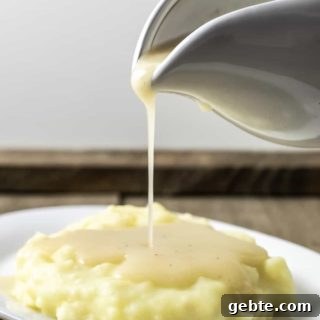 Simple 3-Ingredient Chicken Gravy Made from Scratch 7 easy 5 ingredient chicken gravy being poured over mashed potatoes