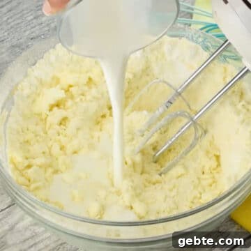 Lemon Cake Truffles: Zesty Bite-Sized Dessert Recipe 6 Milk being poured in the mixture.