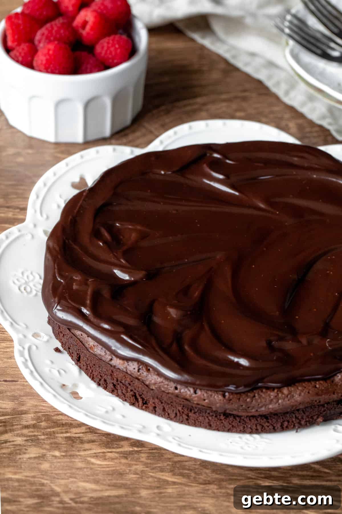 Flourless Chocolate Cake Recipe: Rich, Decadent and Gluten-Free 8 8-inch round flourless chocolate cake with chocolate ganache on top