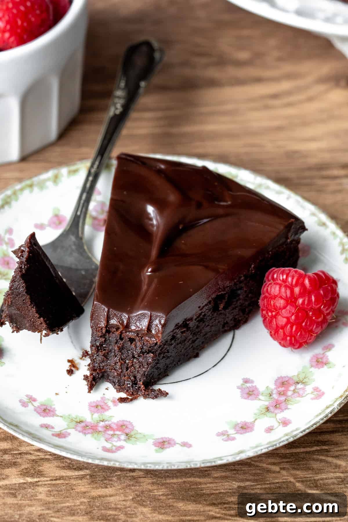 Flourless Chocolate Cake Recipe: Rich, Decadent and Gluten-Free 9 Slice of flourless chocolate cake with a bite taken out