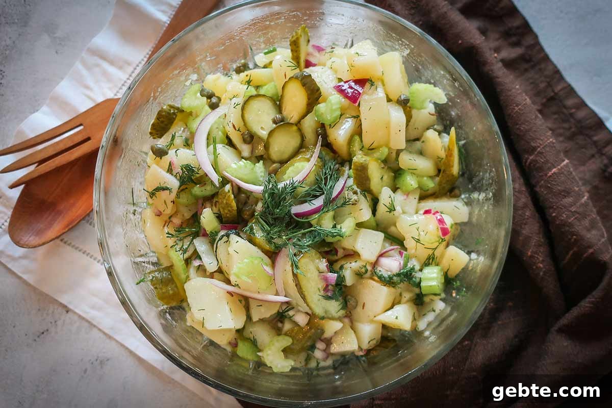 POTATO SALAD IN A LIGHT vinaigrette WITH HERBS IN A BOWL