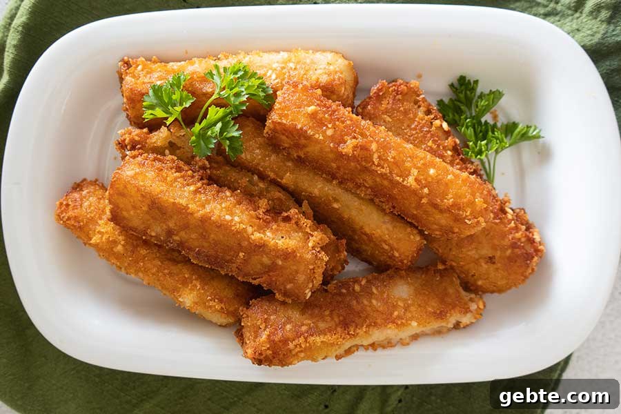 sesame cheese sticks on a plate
