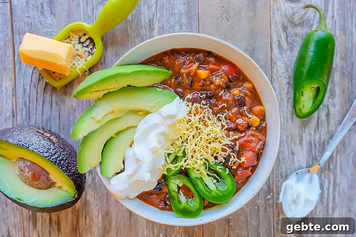 overview of Cincinnati black bean chilli with toppings in a bowl