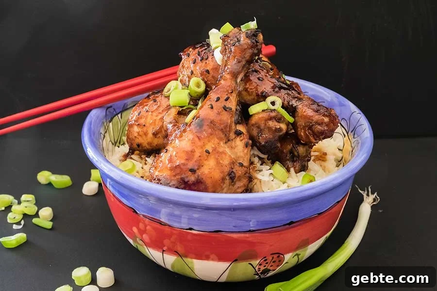 chicken drumsticks in Peking sauce over rice