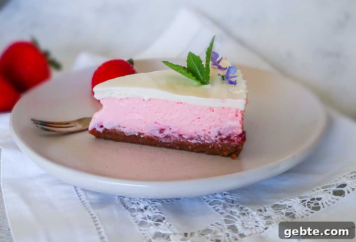 slice of 4 layer strawberry cheesecake