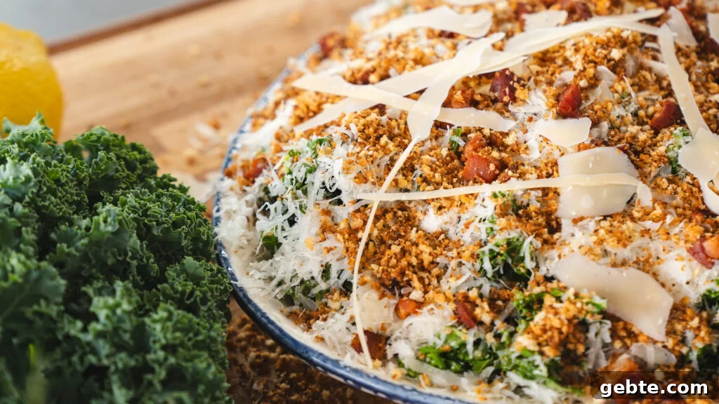 Viral Kale Caesar Salad for Quick Weeknight Dinners 3 Viral kale salad with caesar dressing on a white platter.