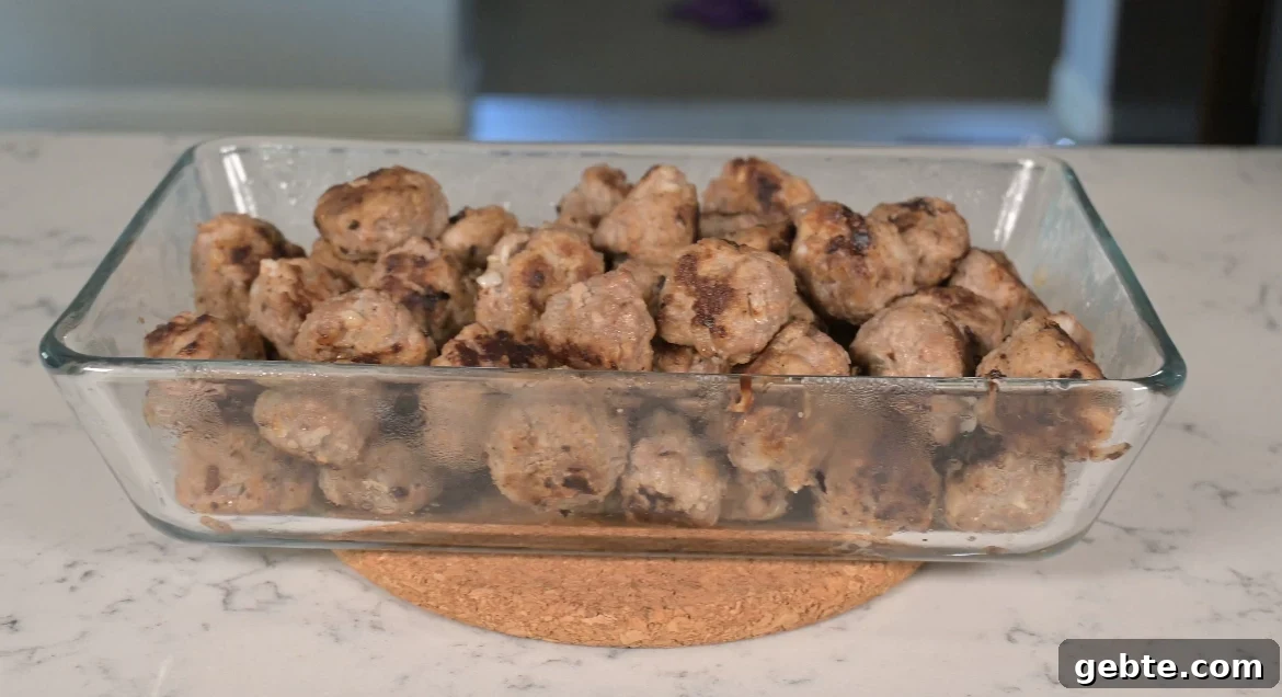 Authentic Swedish Köttbullar Recipe: Classic Meatballs with Creamy Gravy 18 Meatballs in a dish.