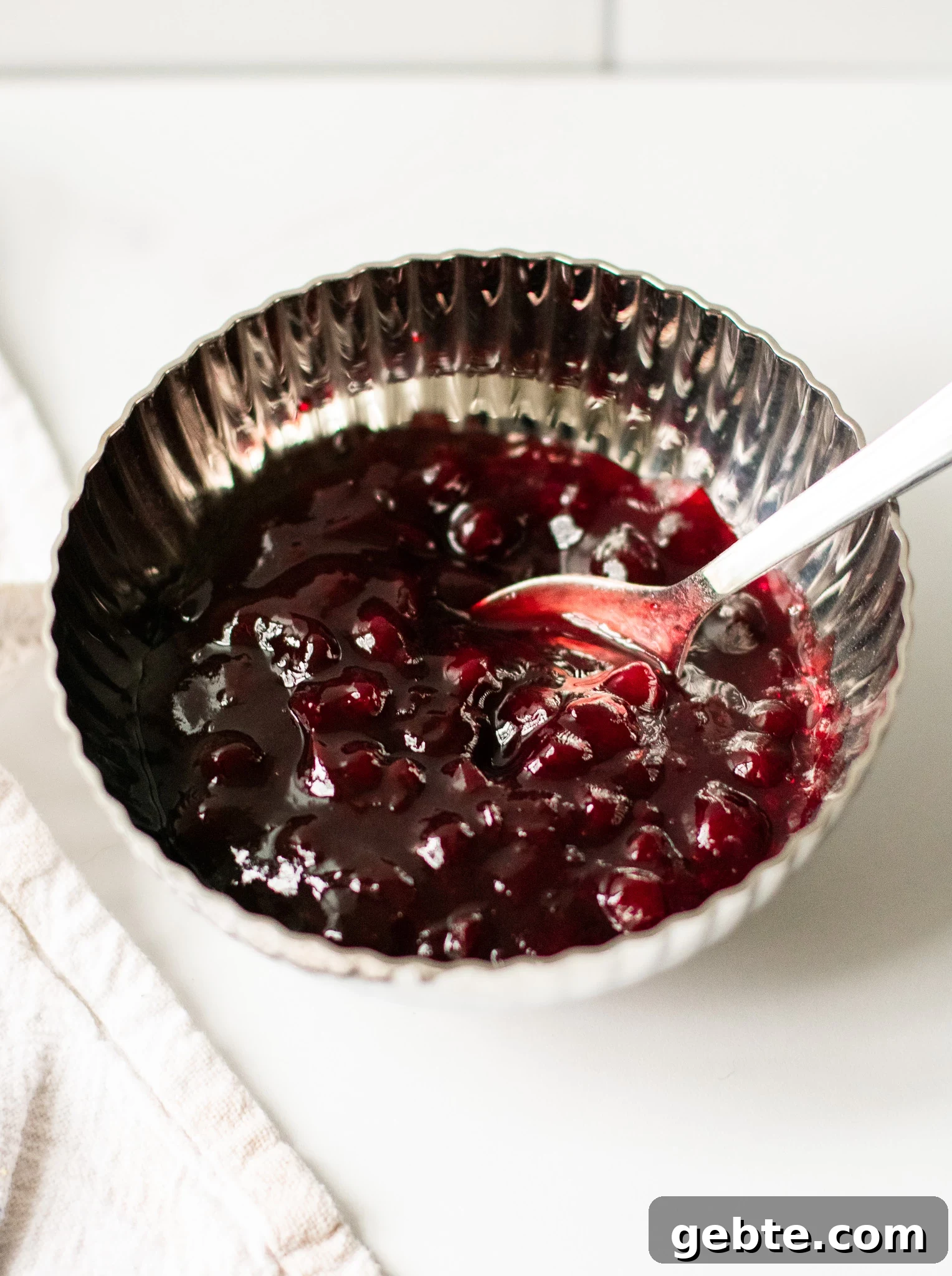 Authentic Swedish Köttbullar Recipe: Classic Meatballs with Creamy Gravy 8 A bowl of lingonberry jam.
