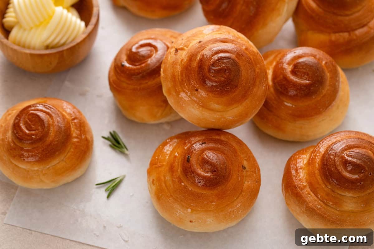 Baked curlicue rolls arranged on a countertop.